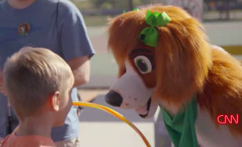 Leilia interacting with a child at a charity event.