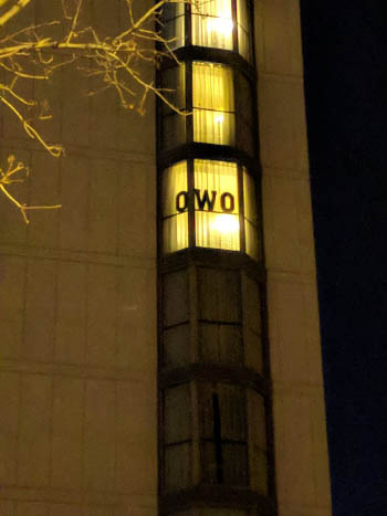 The OWO meme makes an appearance in a window of the Hilton at Midwest FurFest 2017. Photo by @kadengshep on Twitter.